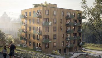 Moderne leilighetsbygg med grønt område